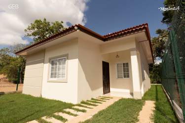 Elegant living room with mounted TV and wooden accents Villa Marinas La Chorrera Panama