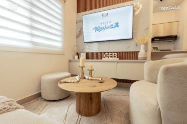 Bright open kitchen with island, dining and living area new house Villa Marinas Panama