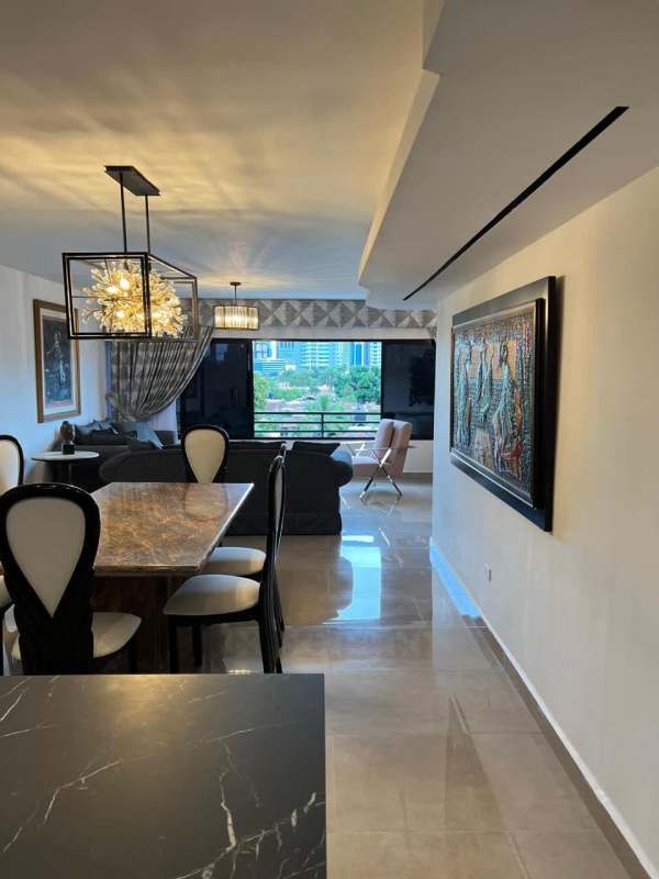 Open kitchen with marble countertop island, stainless appliances PH Country Park San Francisco Panama