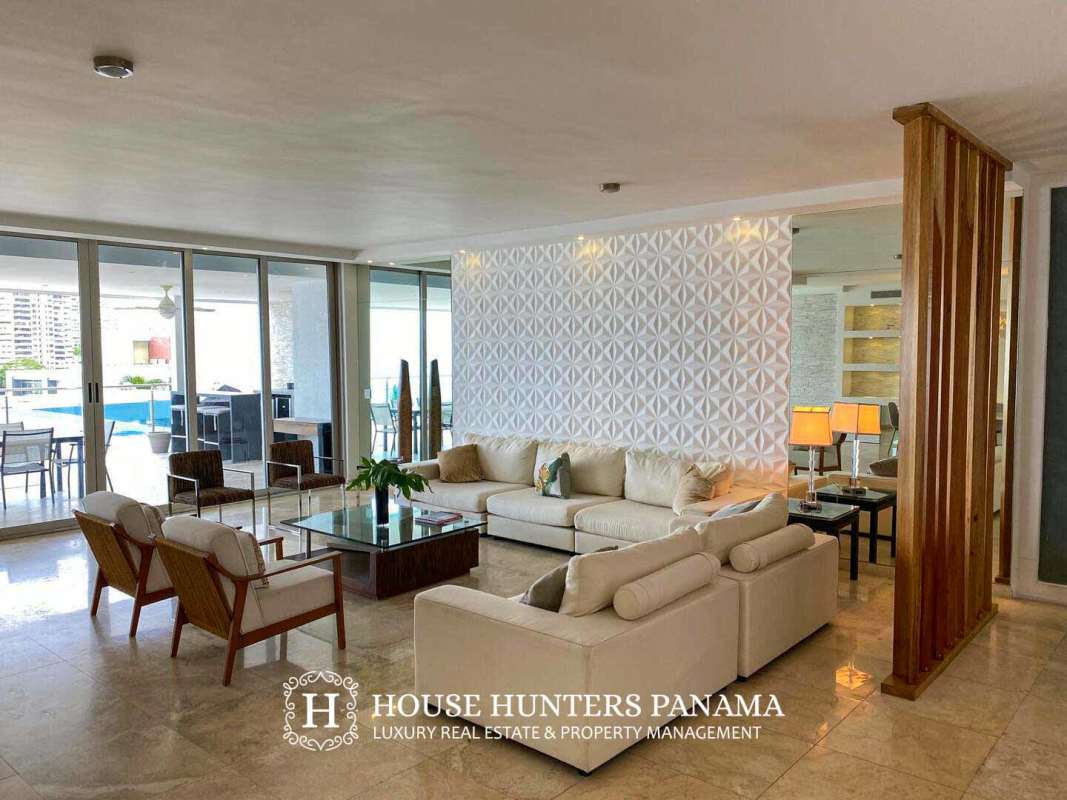 Elegant dining area with illuminated wall shelves, marble table, in luxury condo PH Aqualina Punta Pacifica City Panama