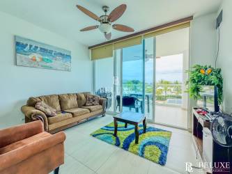 Bedroom with AC, ceiling fan, tiled floor in furnished Playa Blanca condo PH Water Ways Panama