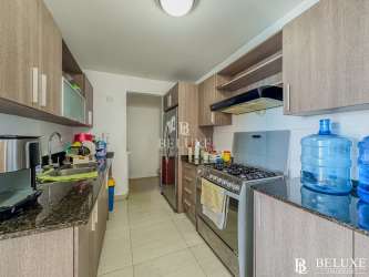 Kitchen with granite counters, cabinets, stove PH Water Ways Playa Blanca Panama