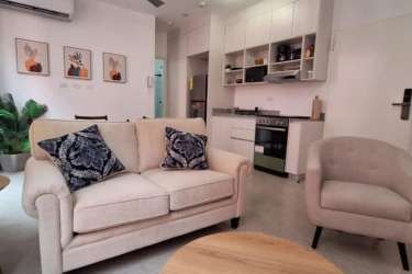 Modern kitchen area with appliances integrated with bright living room Casa Korsi Casco Viejo