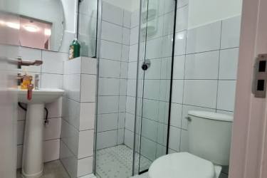 Comfortable bedroom with built-in closet, large window, and Juliet balcony at Casa Korsi Casco Viejo Panama