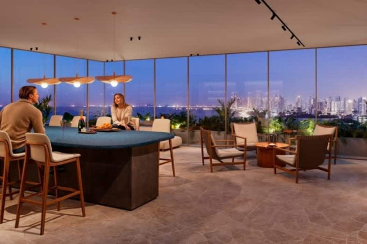 Open lounge area large windows city night view at PH Kai Costa del Este luxury condominium Panama