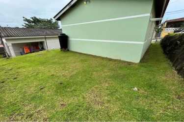Side yard with grassy area and water tank El Edén Panama Oeste for sale