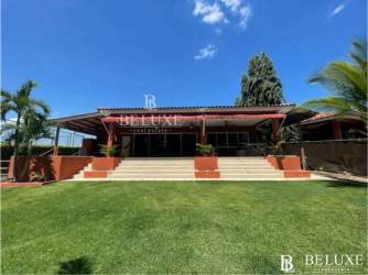 Bedroom with split AC, ceiling fan and window at Nueva Gorgona beach house for sale