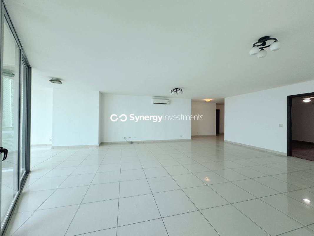 Spacious master bedroom with wood flooring and skyline view in Allure Avenida Balboa Panama