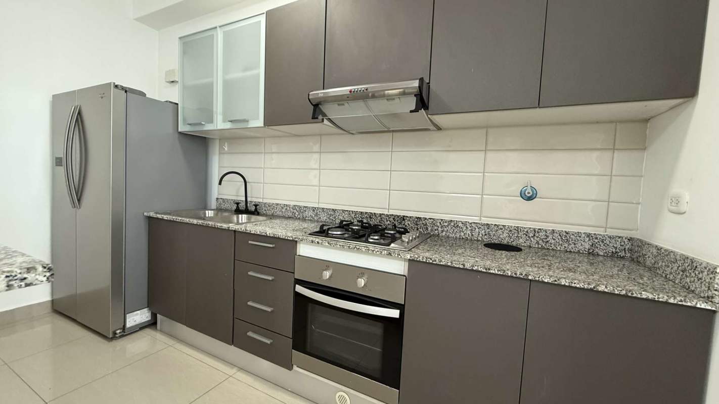 Open kitchen with granite countertops, modern cabinets, appliances in PH San Francisco Bay Panama