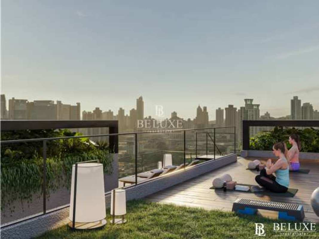 Stylish rooftop dining seating and ocean view at PH Be Living sustainable condo Panama City