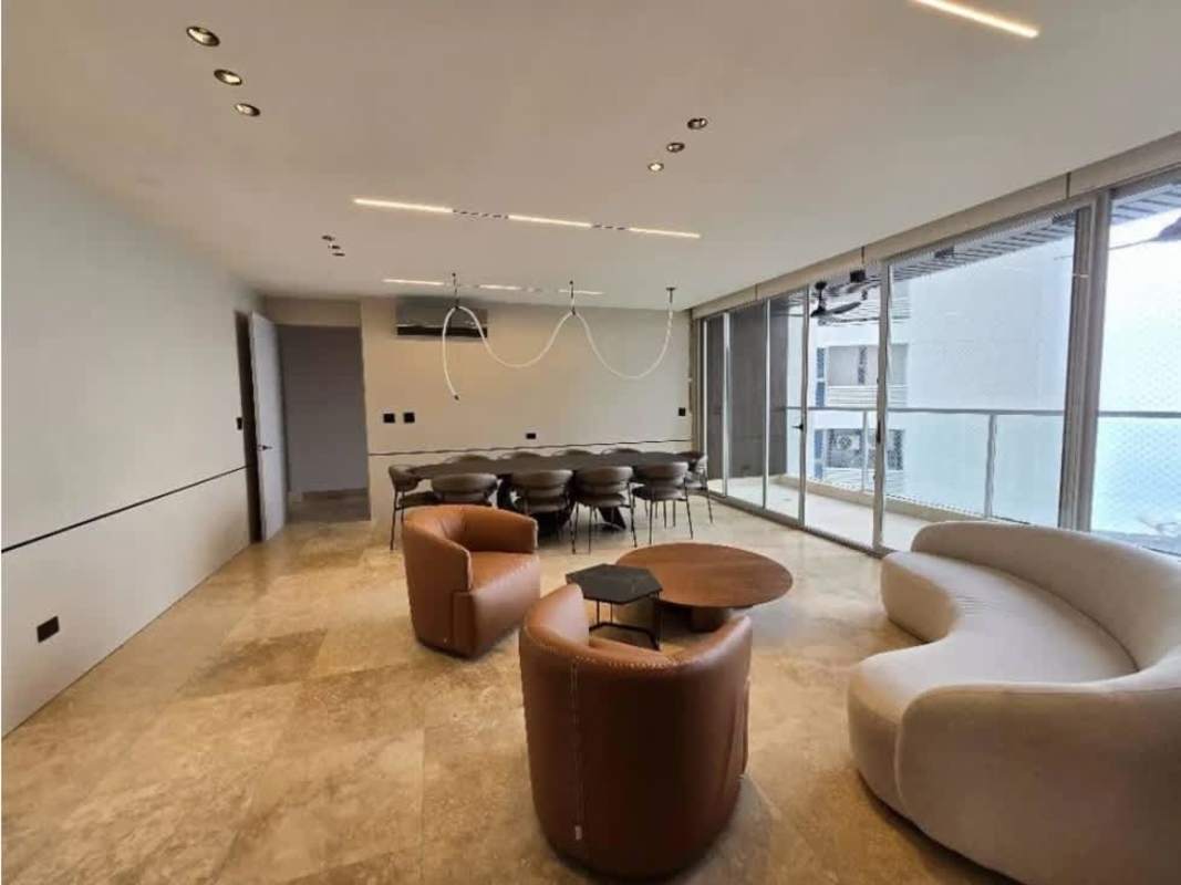 Modern dining area and living lounge with panoramic ocean window PH Oceania Punta Pacífica Panama