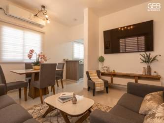 Open concept living and dining area with modern furnishings in Residencial Los Villas 2 Panama