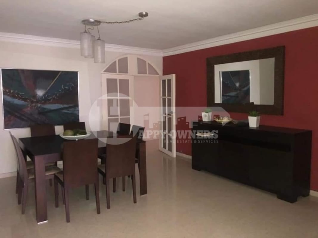 Covered outdoor lounge/dining common area with orange columns PH Marsella Marbella Panama City