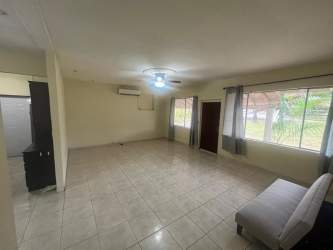 Modern minimalist kitchen with granite countertops and garden window in Panama Pacifico