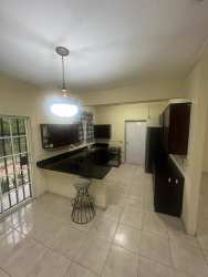 Modern kitchen and dining with ample counter space in Garden City Howard Panama