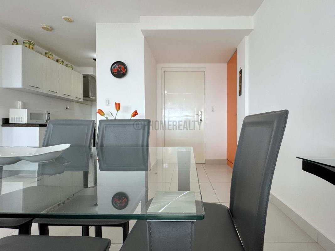 Luxury bathroom with glass enclosed shower and granite vanity in Panama apartment