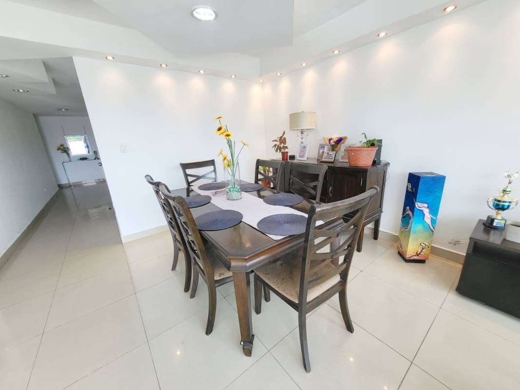 Spacious bedroom with large window king-sized bed tile floors PH Pine Hill Albrook