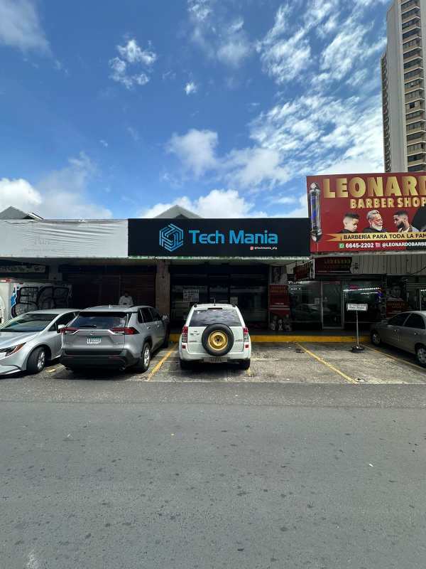 Open interior of commercial retail space with wooden flooring, black accents, lighting in Obarrio Panama
