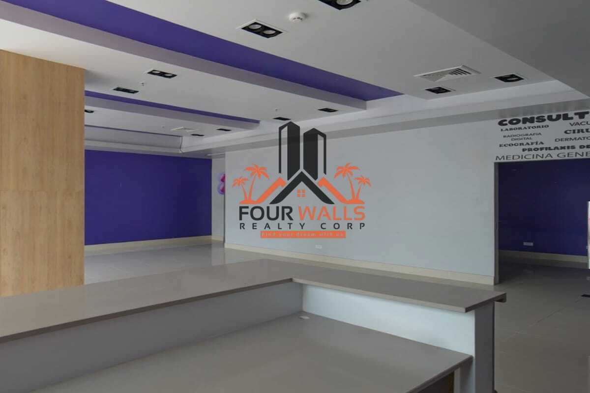 Reception lobby in retail space with purple accent walls and wood paneling Balboa Boutiques Panama