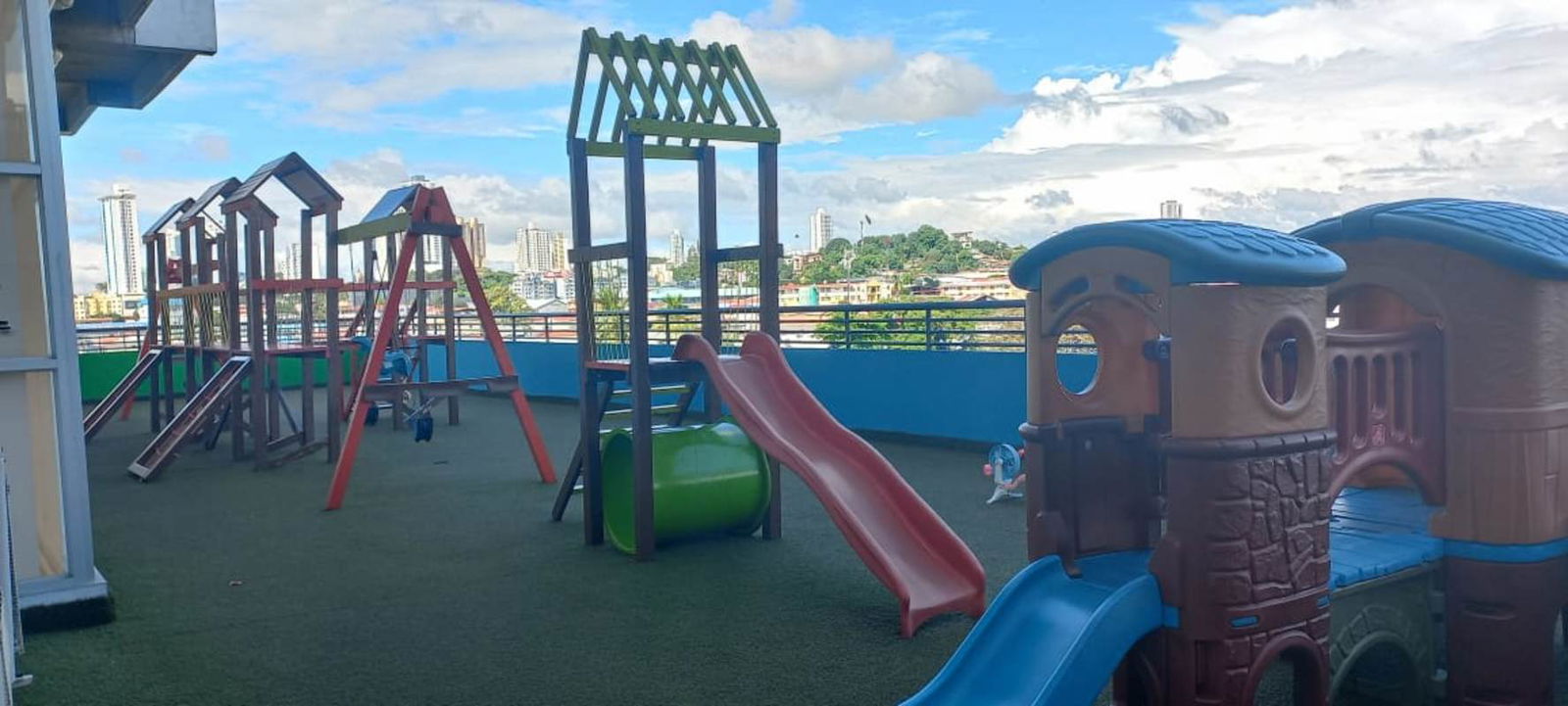 Children's playground with slides and swings on rooftop of PH Lefevre 75 in Panama