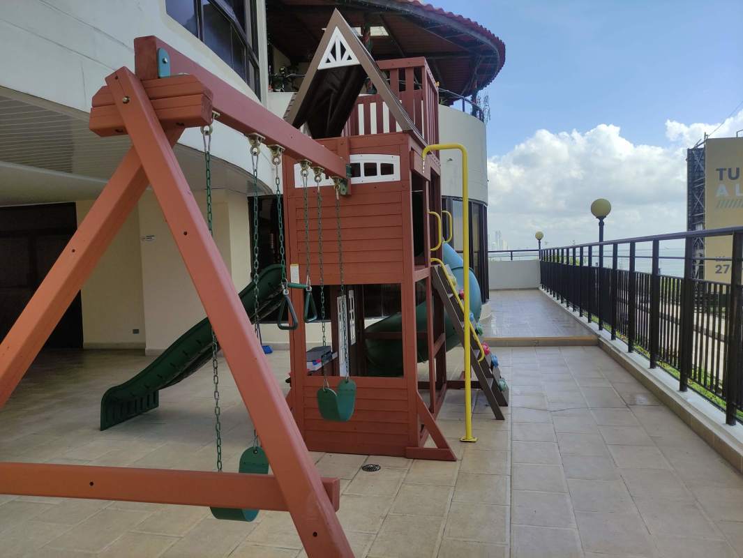 Open living room with large windows and balcony ocean views for sale Punta Pacifica Panama