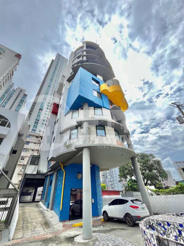 Kitchen with granite counters, built-in stove, oven and red cabinets in PH Faro del Sur Panama City