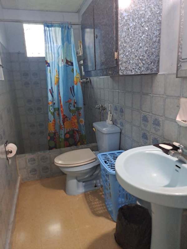 Laundry area with sink, washing machine, propane tanks Villa de las Fuentes Panama