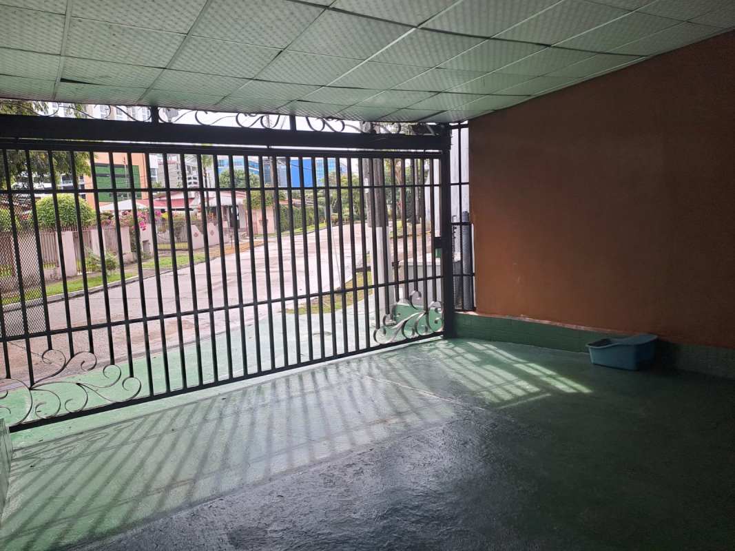 Secure covered parking with electric gate and tiled floor house for sale Villa de las Fuentes Panama City