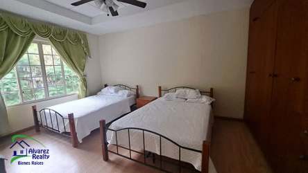Traditional bathroom with glass-enclosed shower, double vanity PH Boquete Gardens Panama