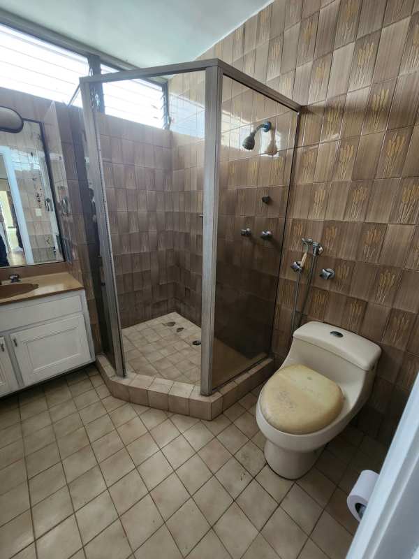 Bathroom with tile walls, glass shower enclosure, vanity sink in PH Paitilla Penthouse Panama
