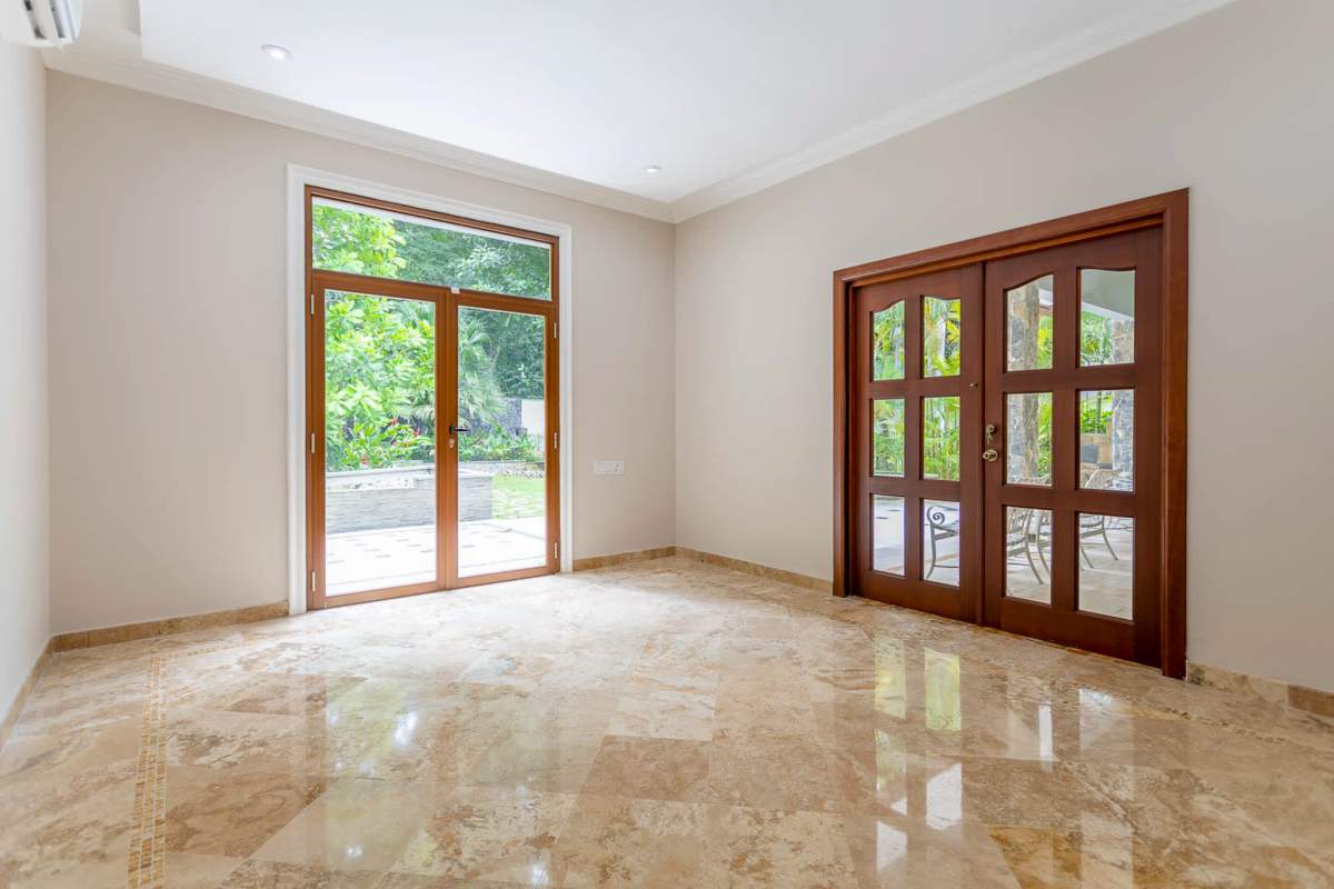 Kitchen with granite island, stainless steel appliances, large window Camino de Cruces house Panama