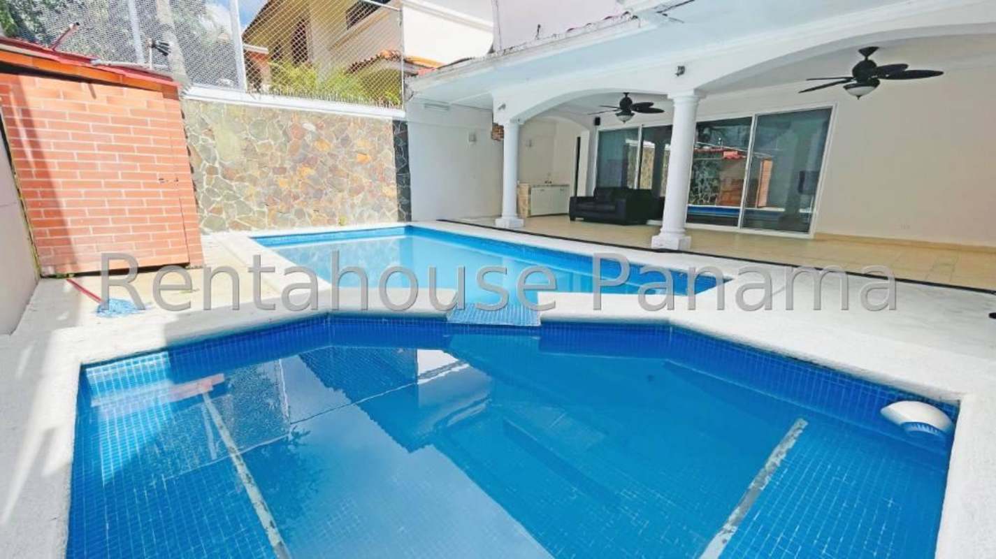 Private swimming pool with covered patio lounge in spacious La Alameda home Panama City