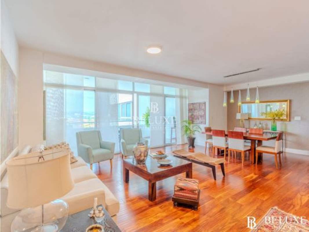 Modern furnished living room with floor to ceiling windows Costa del Este Panama