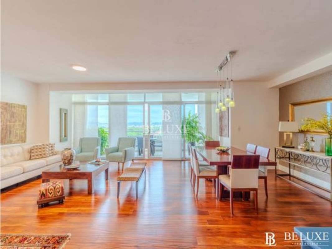 Furnished open plan living dining area with skyline views in PH Elevation