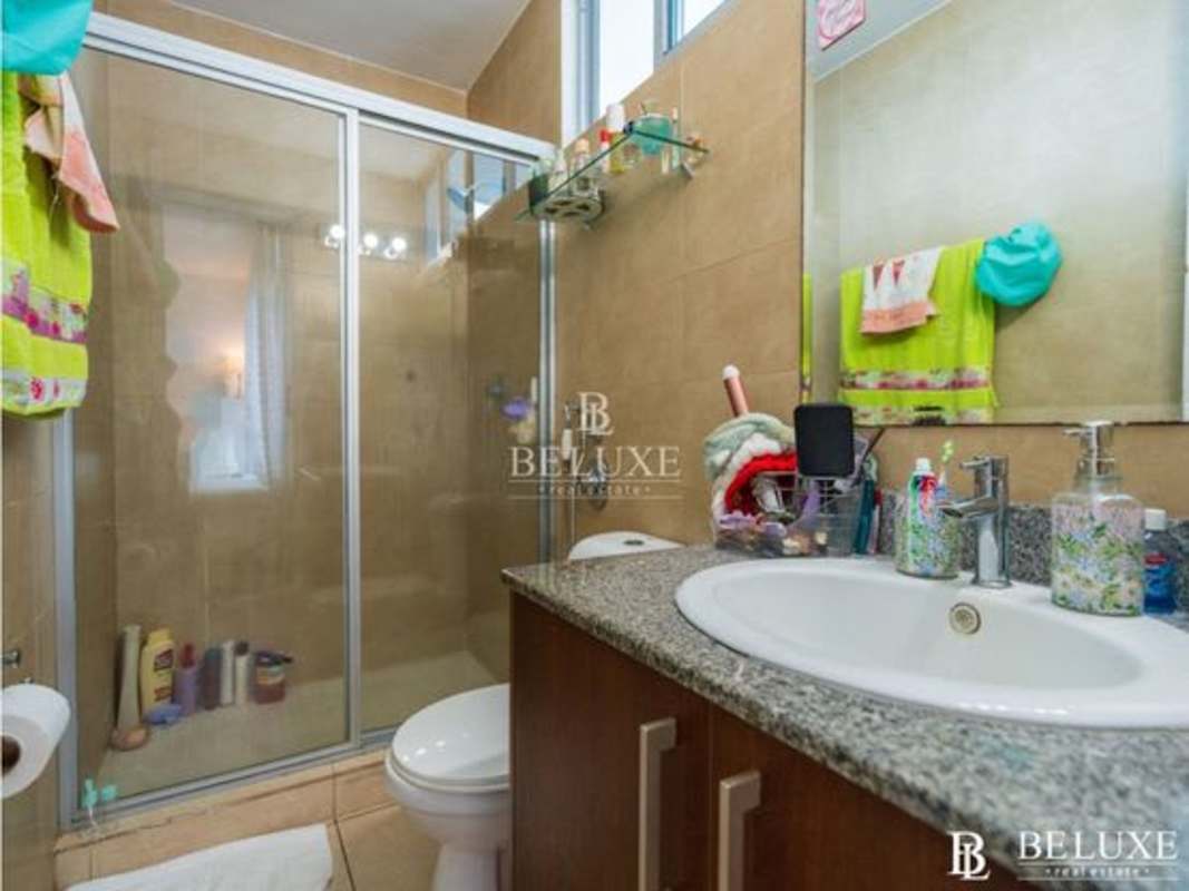 Modern granite countertop kitchen with stainless appliances in PH Costa View Panama