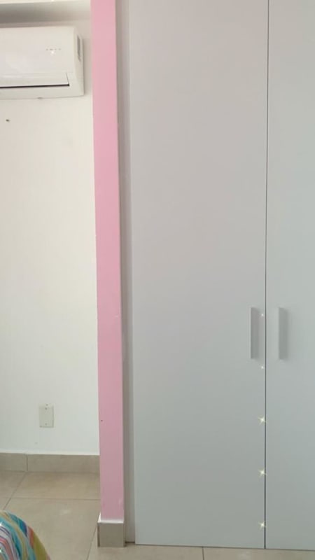 Bedroom showing bed, colorful bedspread, window with curtains, AC, in PH Carrasquilla Towers Panama