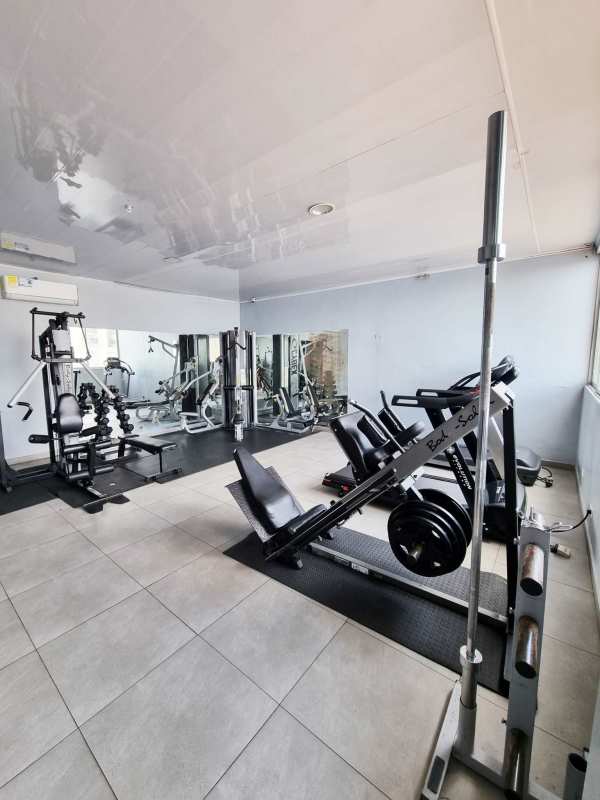 Terrace barbecue area with grills, city skyline at PH Victoria Hills Panama