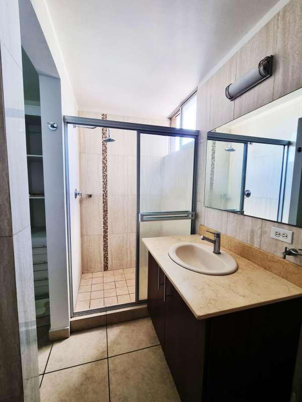 Rooftop play area with colorful equipment and city skyline PH Victoria Hills Panama