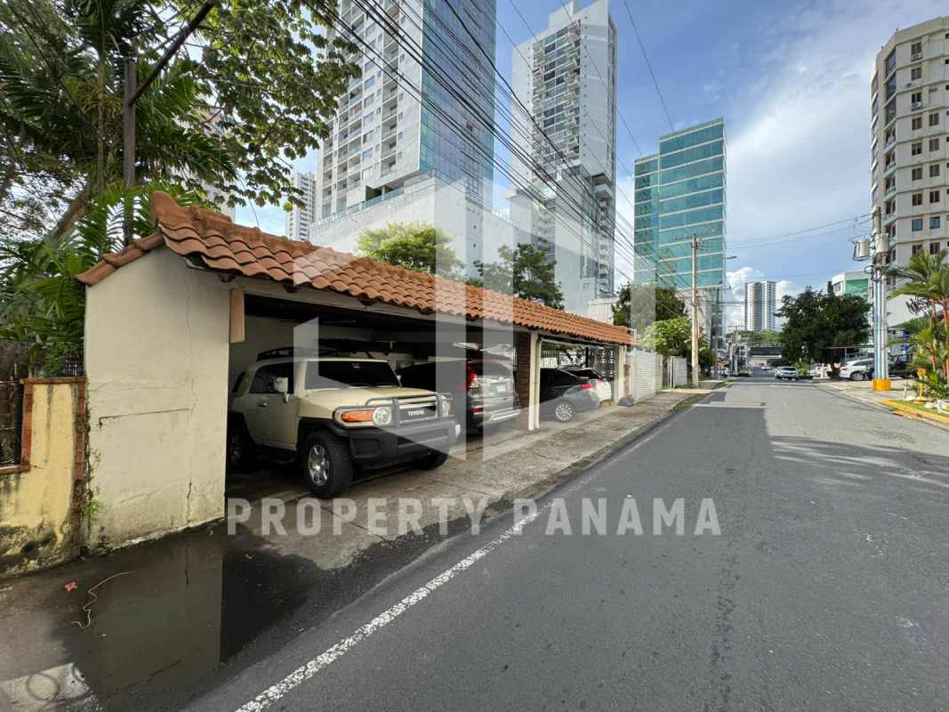 Covered parking with tiled roof and city skyline in background San Francisco Panama