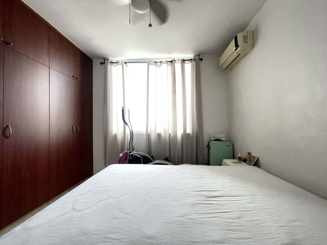 Minimalist bedroom with wooden wardrobe, AC, curtain window in PH Marquis Tower