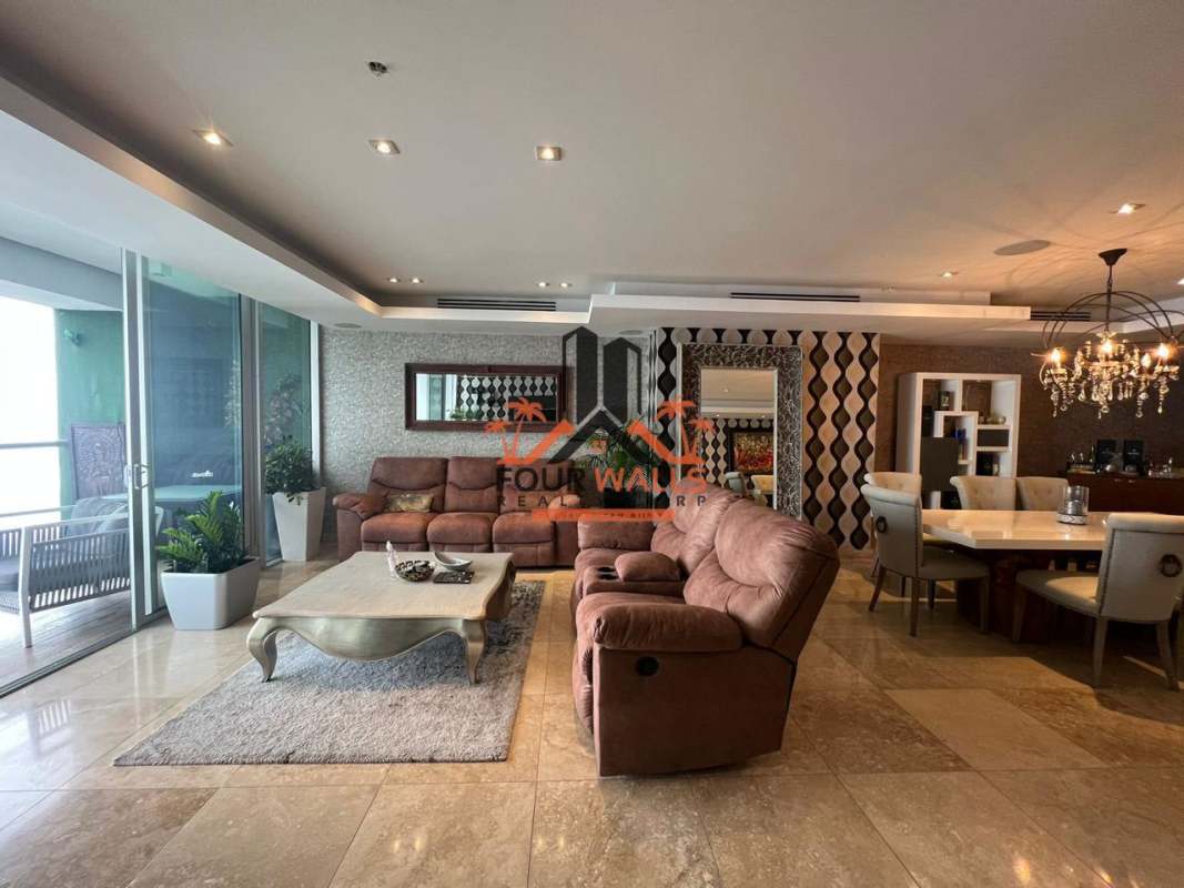 Spacious living room with marble floors, ocean and skyline view windows in PH Rivage Panama City