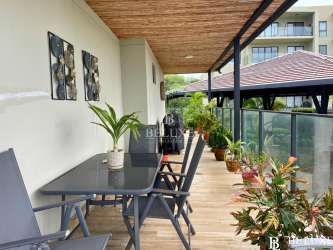 Elegant master bedroom with Pacific Ocean view balcony at PH Solaria Punta Caelo