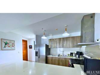 Modern open kitchen at PH Solaria Punta Caelo with island and premium finishes