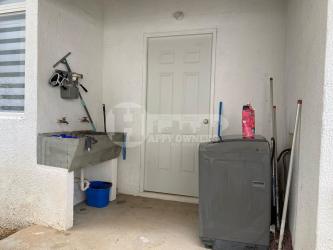 Laundry room with sink, washing machine, storage, bright lighting Paradise Point Coronado Panama