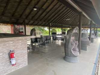 Swimming pool with palapa huts and tropical landscaping Paradise Point Coronado Panama