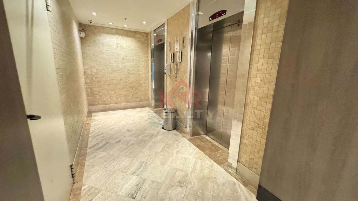 Spacious open-plan living dining with bright natural light porcelain tile floors balcony city view