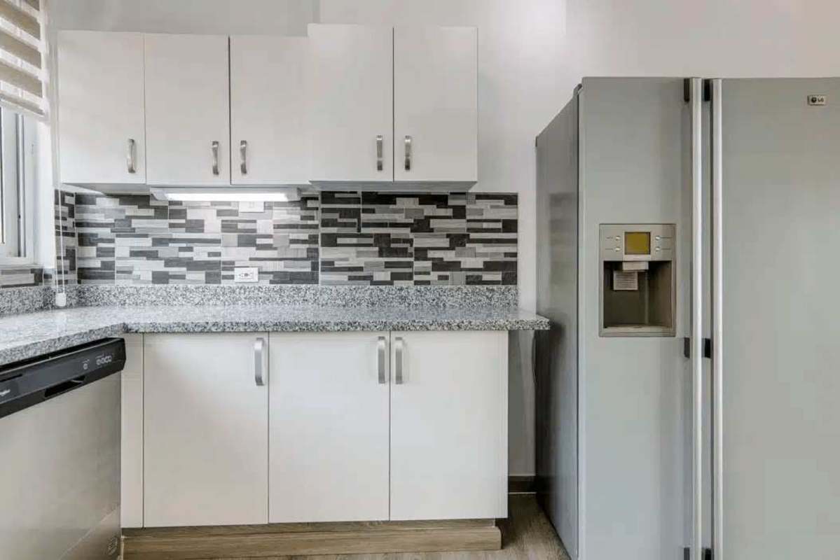Luxury open kitchen with granite and stainless appliances at Causeway Towers Amador Panama