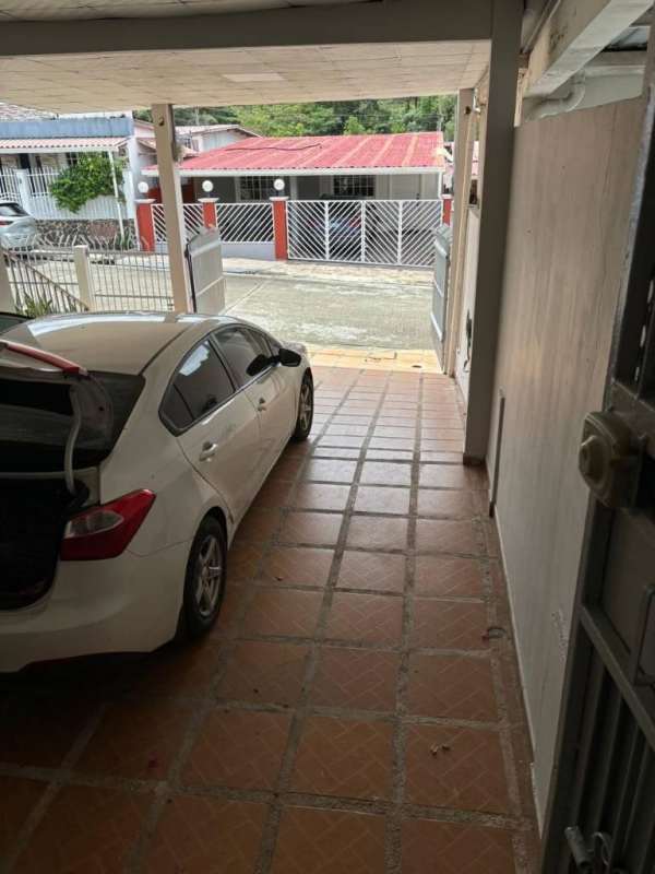 Dining room with wooden set open to modern kitchen Brisas del Golf Panama