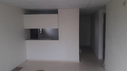 Simple single-story starter house with security bars and front yard in La Chorrera Panama