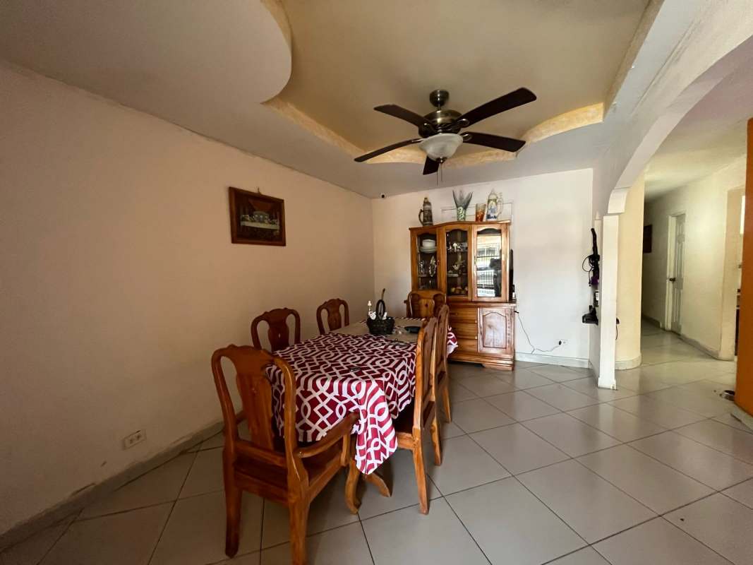 Dining space with wooden furniture, ceiling fan Villa de Las Fuentes Panama